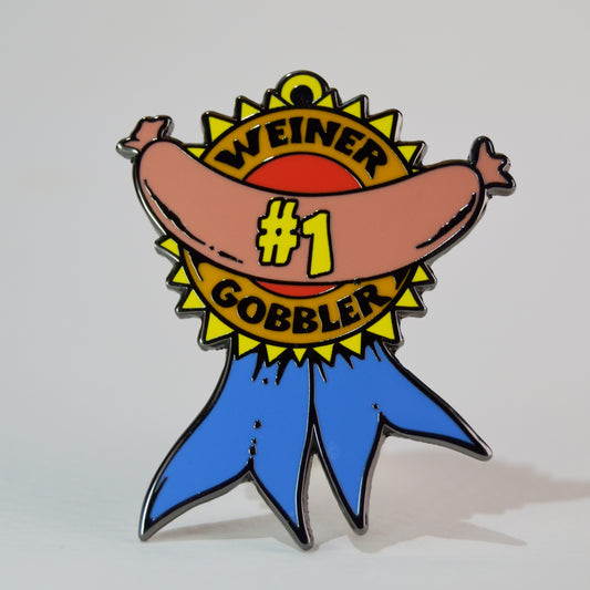 Pin with a cartoon sausage character on a white background